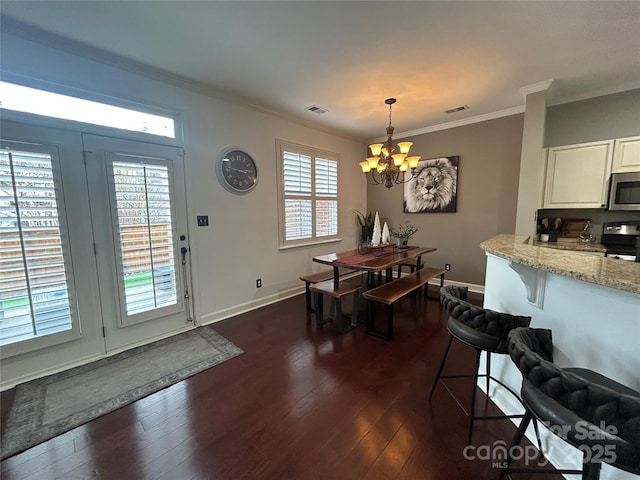 dining area featuring dark wood-style floors, visible vents, ornamental molding, and baseboards