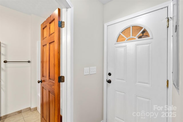 foyer with light tile patterned floors