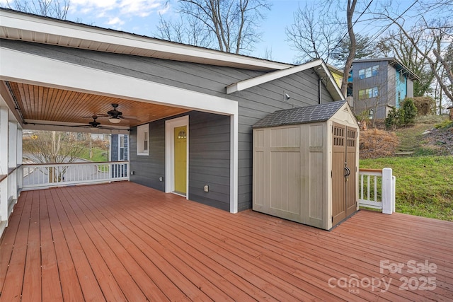 deck with a shed and ceiling fan