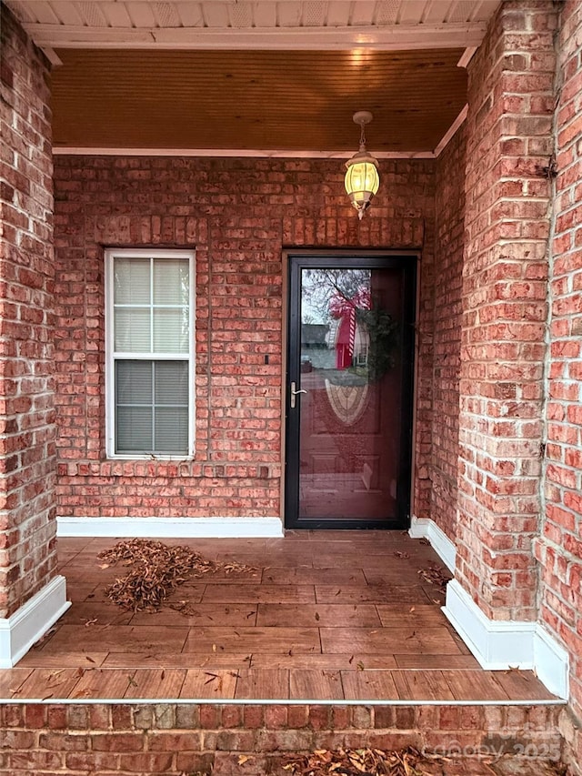 doorway to property featuring covered porch