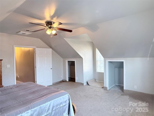 bedroom with ceiling fan, light colored carpet, and vaulted ceiling