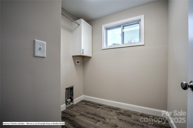 washroom with cabinet space, baseboards, dark wood-type flooring, and hookup for an electric dryer