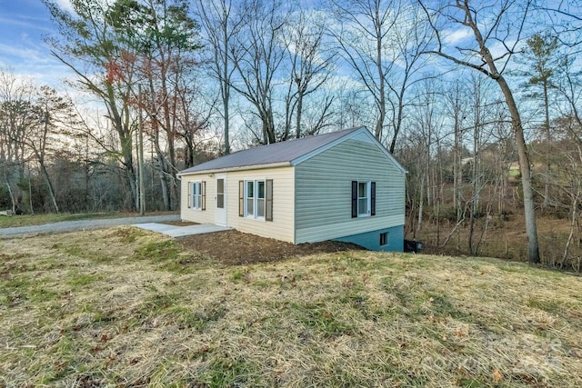 view of property exterior featuring a yard