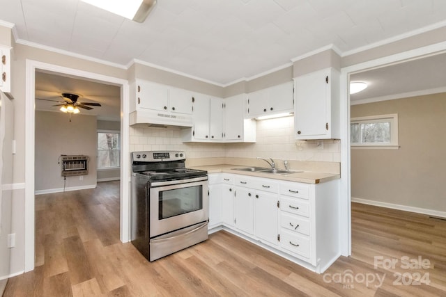 kitchen featuring white cabinets, electric stove, sink, decorative backsplash, and light hardwood / wood-style floors