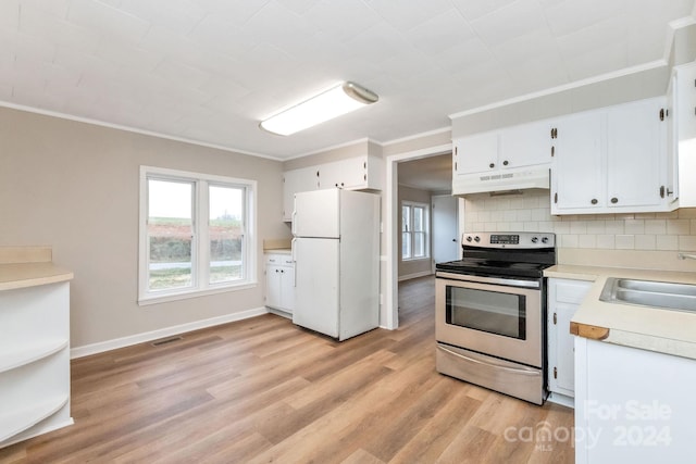 kitchen featuring stainless steel electric stove, sink, light hardwood / wood-style flooring, white fridge, and white cabinetry