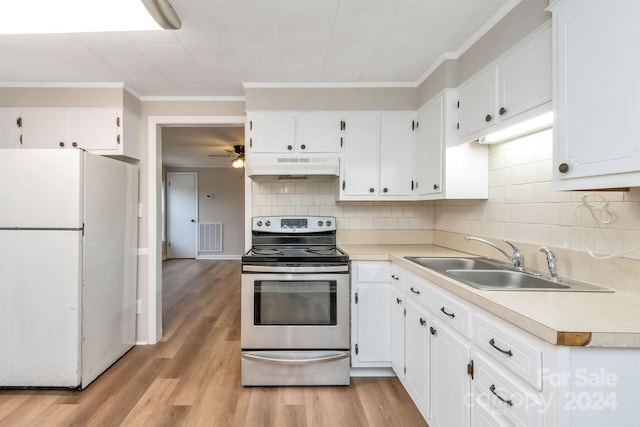 kitchen with white cabinetry, sink, light hardwood / wood-style flooring, white refrigerator, and stainless steel electric range