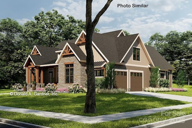 view of front of property with a garage and a front yard