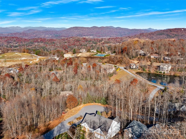 bird's eye view with a water and mountain view