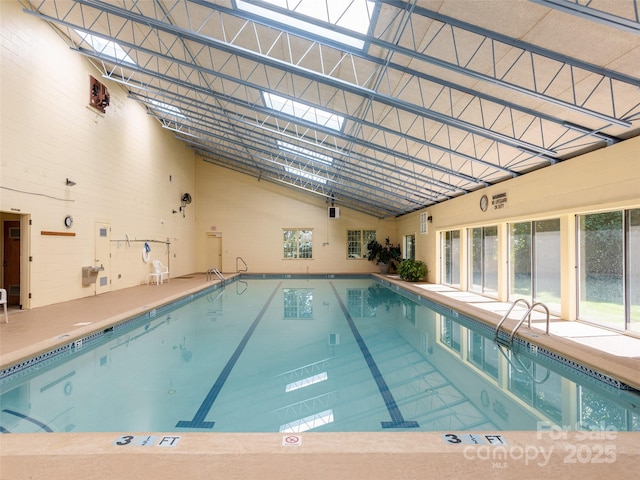 view of swimming pool with a skylight