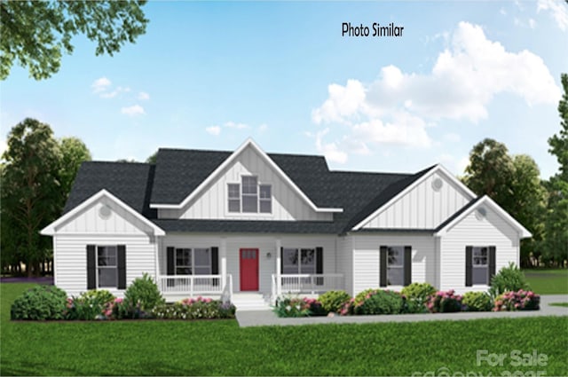 99999 Bay Laurel Ln, Hendersonville, NC 28791 - modern inspired farmhouse featuring board and batten siding, a front yard, covered porch, and roof with shingles