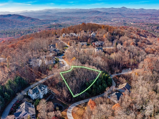 99999 Bay Laurel Ln, Hendersonville, NC 28791 - aerial view of property and surrounding area with a mountainous background and property parcel outlined