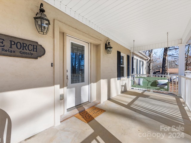 entrance to property with a porch