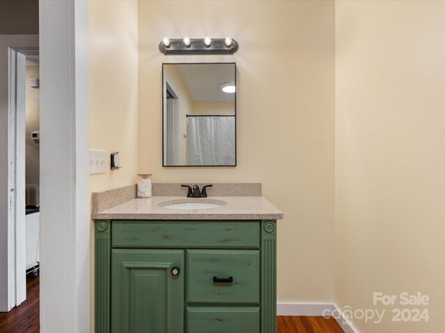 bathroom featuring vanity and wood-type flooring