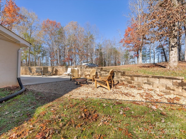 view of yard with a patio area and an outdoor fire pit