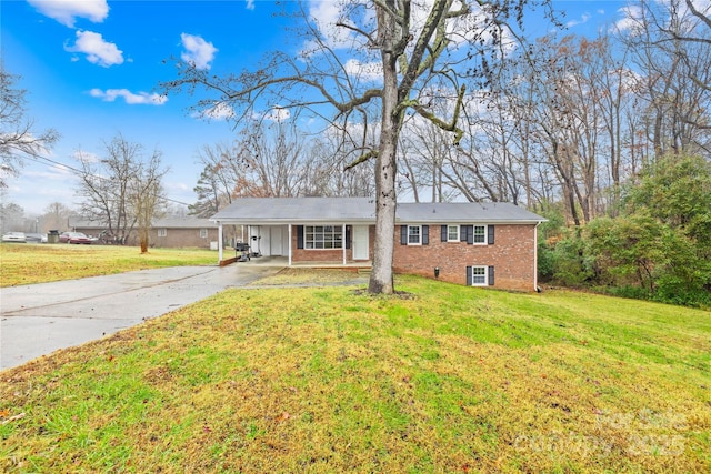 view of front of house with a front lawn and a carport