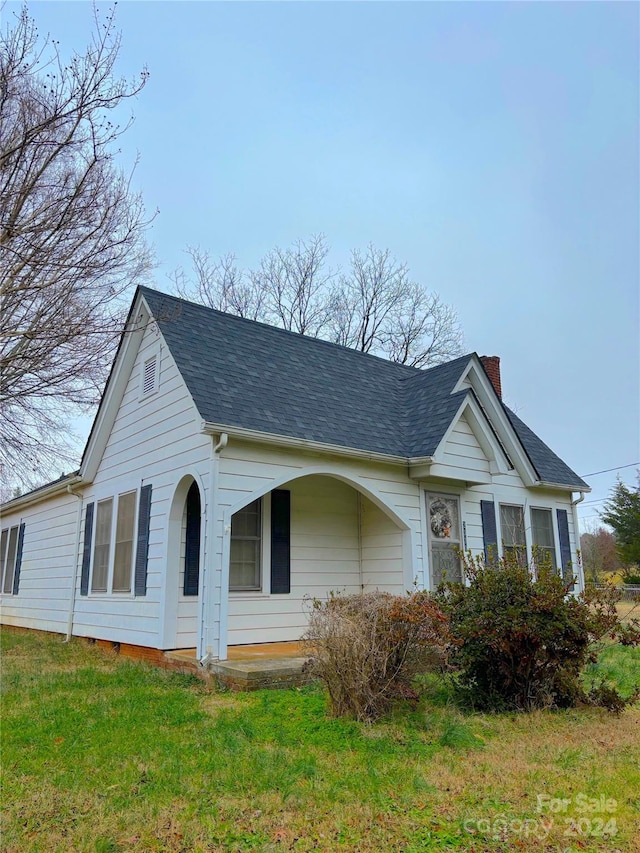 view of home's exterior featuring a lawn