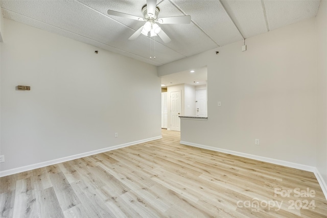 unfurnished room featuring ceiling fan and light hardwood / wood-style floors