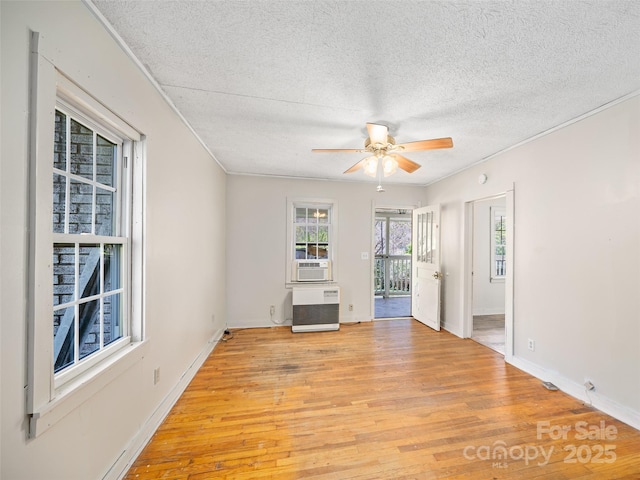 1 Gordon Silvers Rd, Bakersville, NC 28705 - unfurnished room with a textured ceiling, ceiling fan, light wood finished floors, baseboards, and ornamental molding