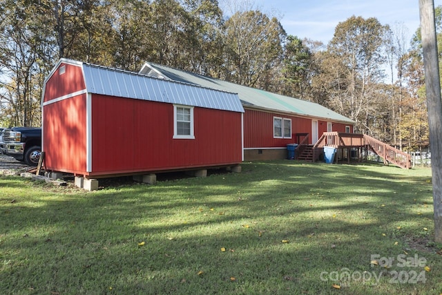 view of outbuilding with a yard