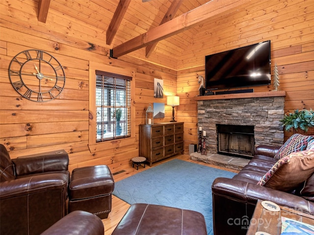 living room featuring lofted ceiling with beams, light wood-type flooring, and wooden walls