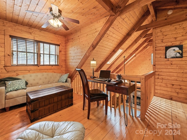 office area with vaulted ceiling with beams, wooden walls, light hardwood / wood-style floors, and wooden ceiling