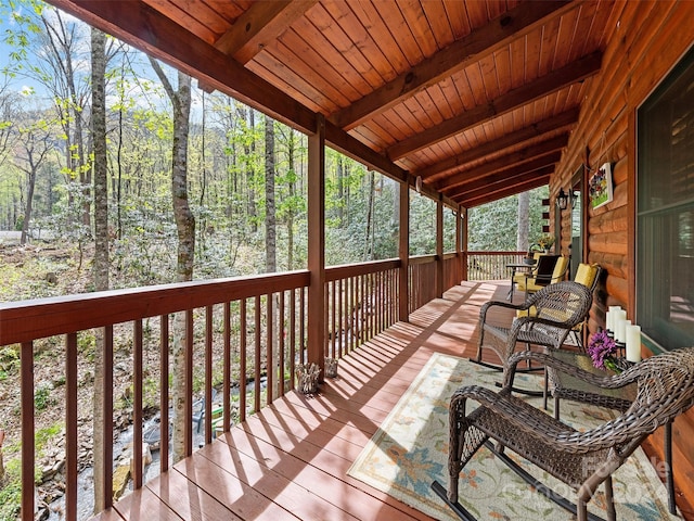 wooden terrace with a porch