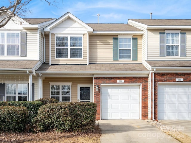 multi unit property featuring a garage