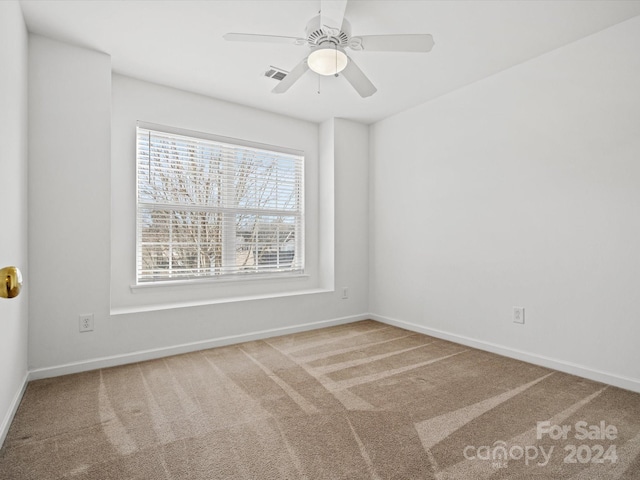 carpeted empty room with ceiling fan