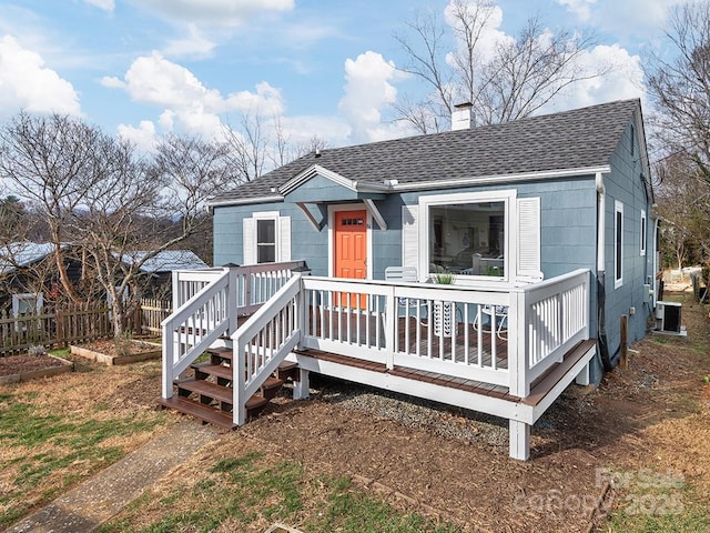 view of front of home featuring cooling unit and a wooden deck