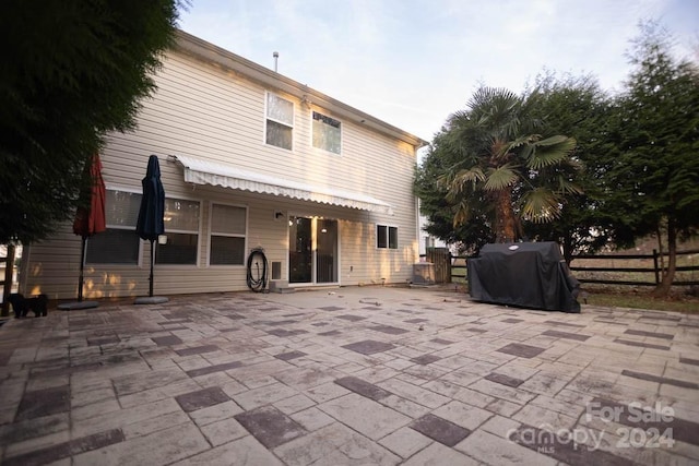 back of house with a patio area