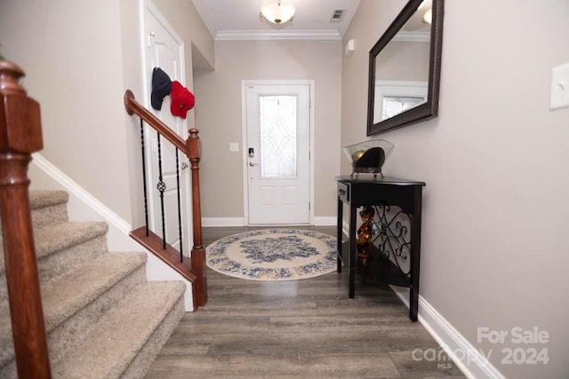 foyer entrance featuring wood-type flooring and ornamental molding