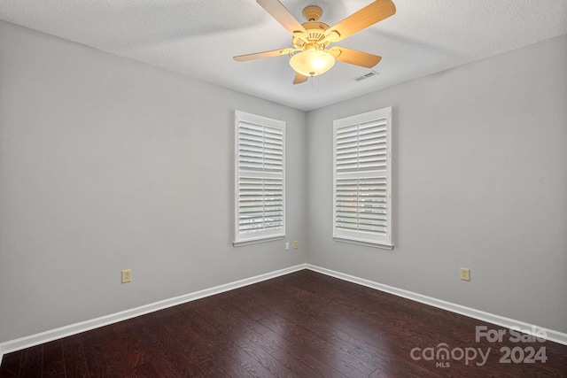 empty room featuring a textured ceiling, hardwood / wood-style flooring, and ceiling fan