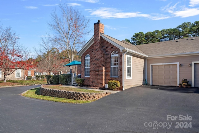 view of property exterior with a garage