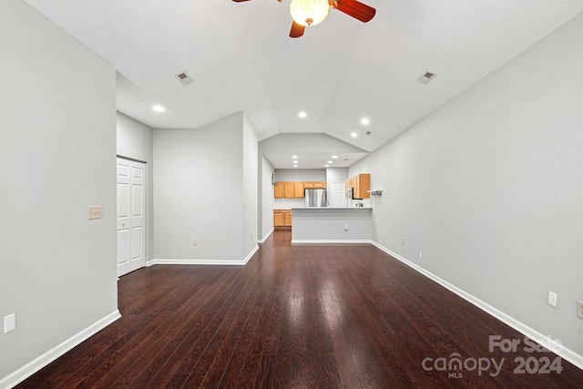 unfurnished living room with ceiling fan, dark wood-type flooring, and lofted ceiling