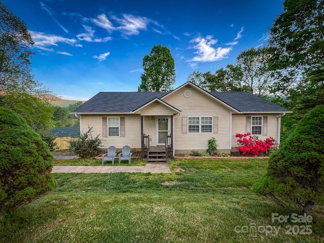 single story home with a front yard