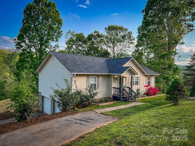 ranch-style house with an attached garage, driveway, and a front yard