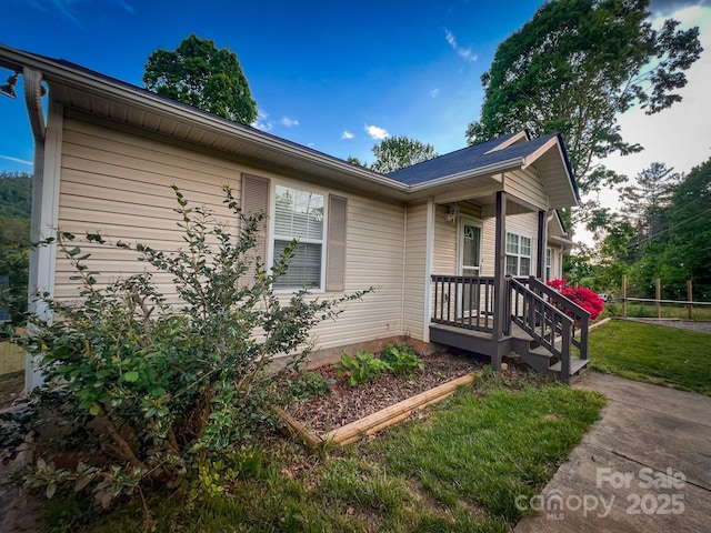 view of home's exterior featuring a lawn