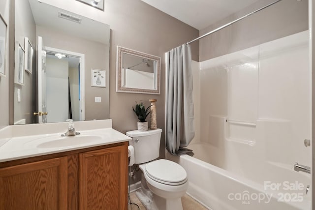 full bath with toilet, vanity, shower / bath combo with shower curtain, and visible vents