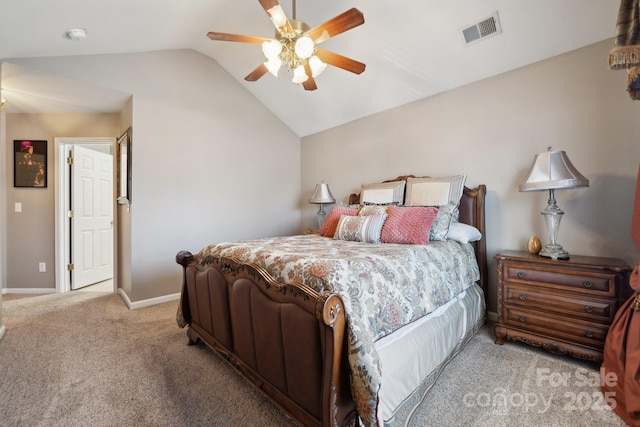 carpeted bedroom featuring lofted ceiling, baseboards, visible vents, and ceiling fan