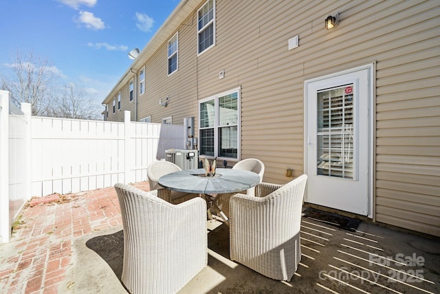 view of patio / terrace featuring outdoor dining space and fence