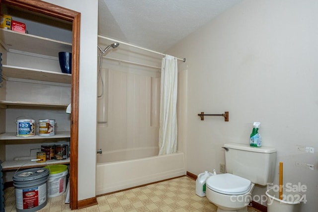 bathroom with a textured ceiling, toilet, and shower / bath combo with shower curtain