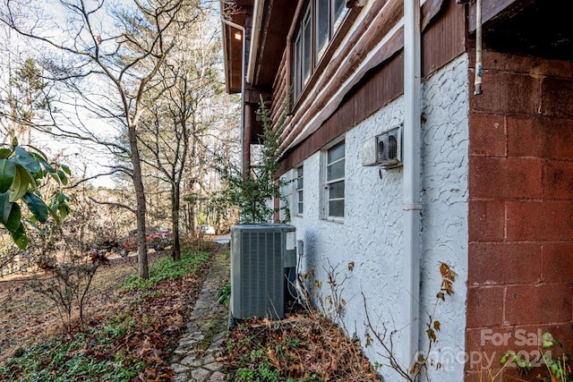 view of side of home featuring central air condition unit