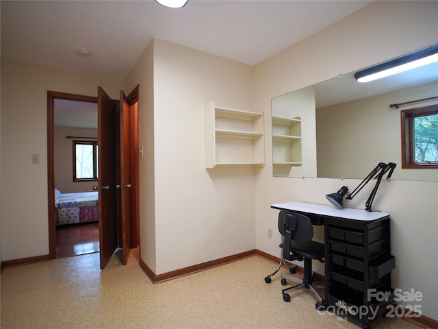office space with baseboards and a wealth of natural light
