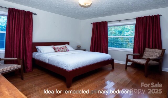 bedroom with baseboards, a textured ceiling, and wood finished floors