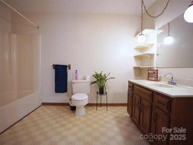 bathroom with baseboards, vanity, tile patterned floors, toilet, and shower / bathtub combination