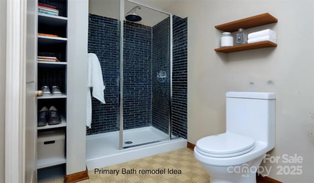 full bath with baseboards, a shower stall, and toilet