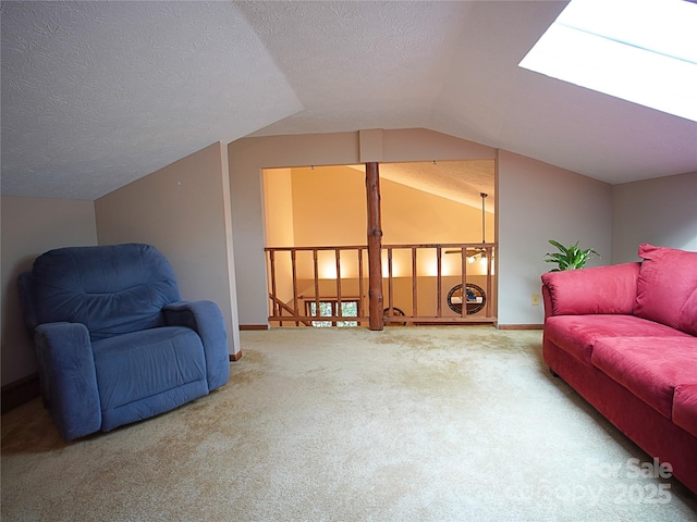 living area featuring a textured ceiling, baseboards, vaulted ceiling, and carpet