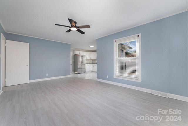 unfurnished living room with light wood-type flooring, ceiling fan, and ornamental molding