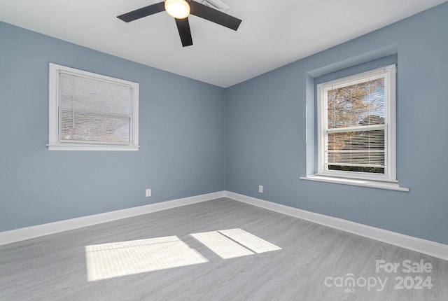 unfurnished room featuring light hardwood / wood-style floors and ceiling fan