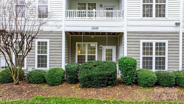 doorway to property featuring a balcony